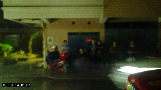Police officers keep guard outside the meeting venue.