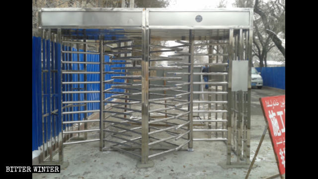 The revolving gates which have not been completely installed at a residential complex