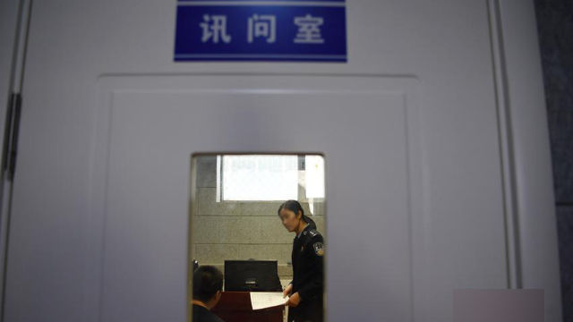 The interrogation room in a police station.
