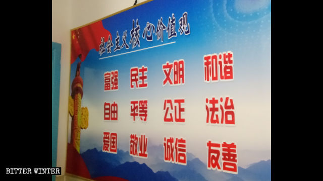 The painting of a mosque was covered with a propaganda poster.