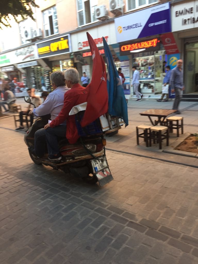 Uyghur motor cyclists flying both the Turkish and the Turkestan flag