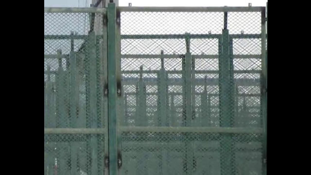 A “study class” surrounded by iron railings and iron wire.